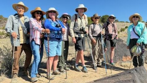 7 trip attendees and their guide